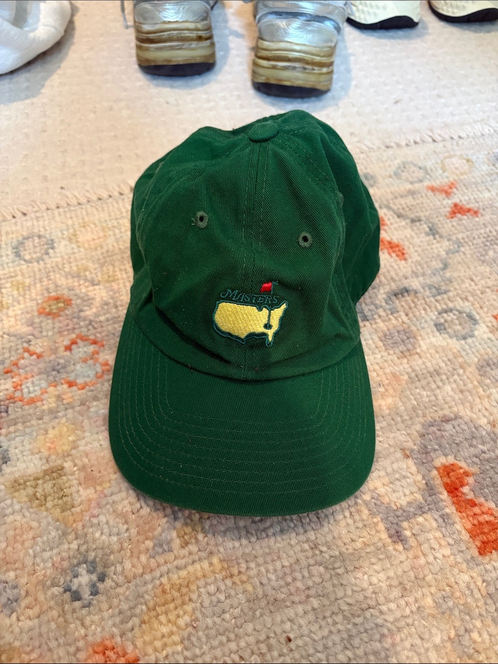 Masters Green Cap with Yellow Masters Logo and Red Pin